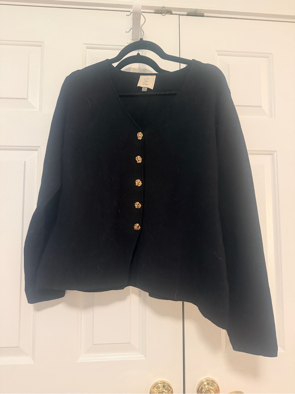 Black cardigan with gold buttons